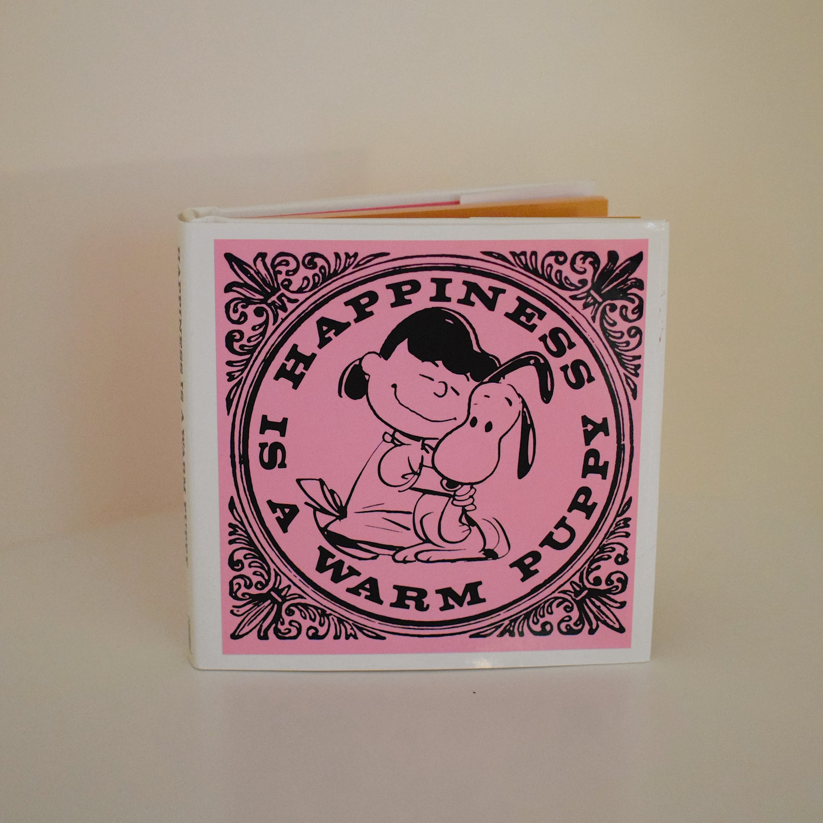 Happiness is a Warm Puppy (PEANUTS) - Hardcover Book By Charles M. Schulz