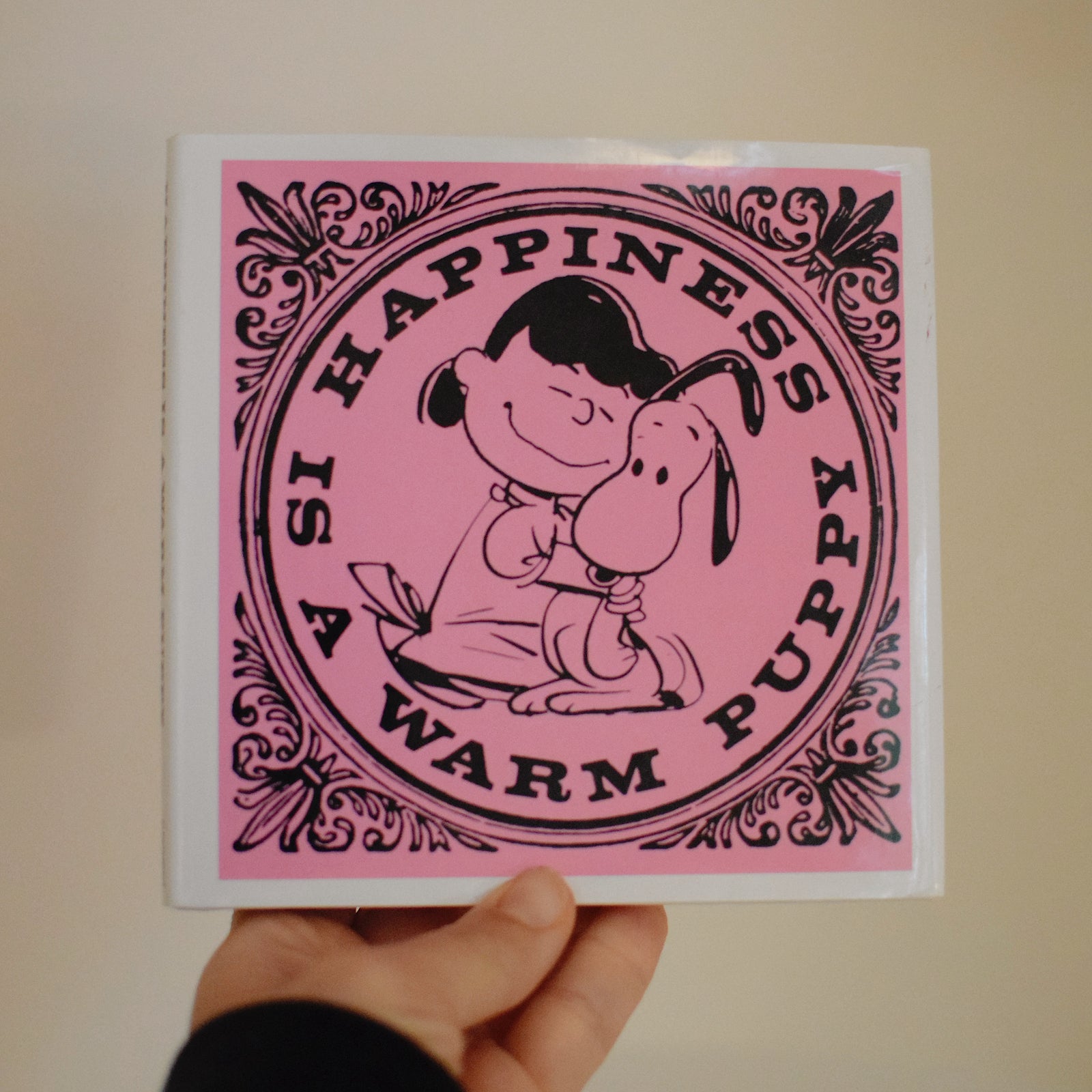 Happiness is a Warm Puppy (PEANUTS) - Hardcover Book By Charles M. Schulz